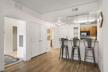 Kitchen with a bar stool and a microwave